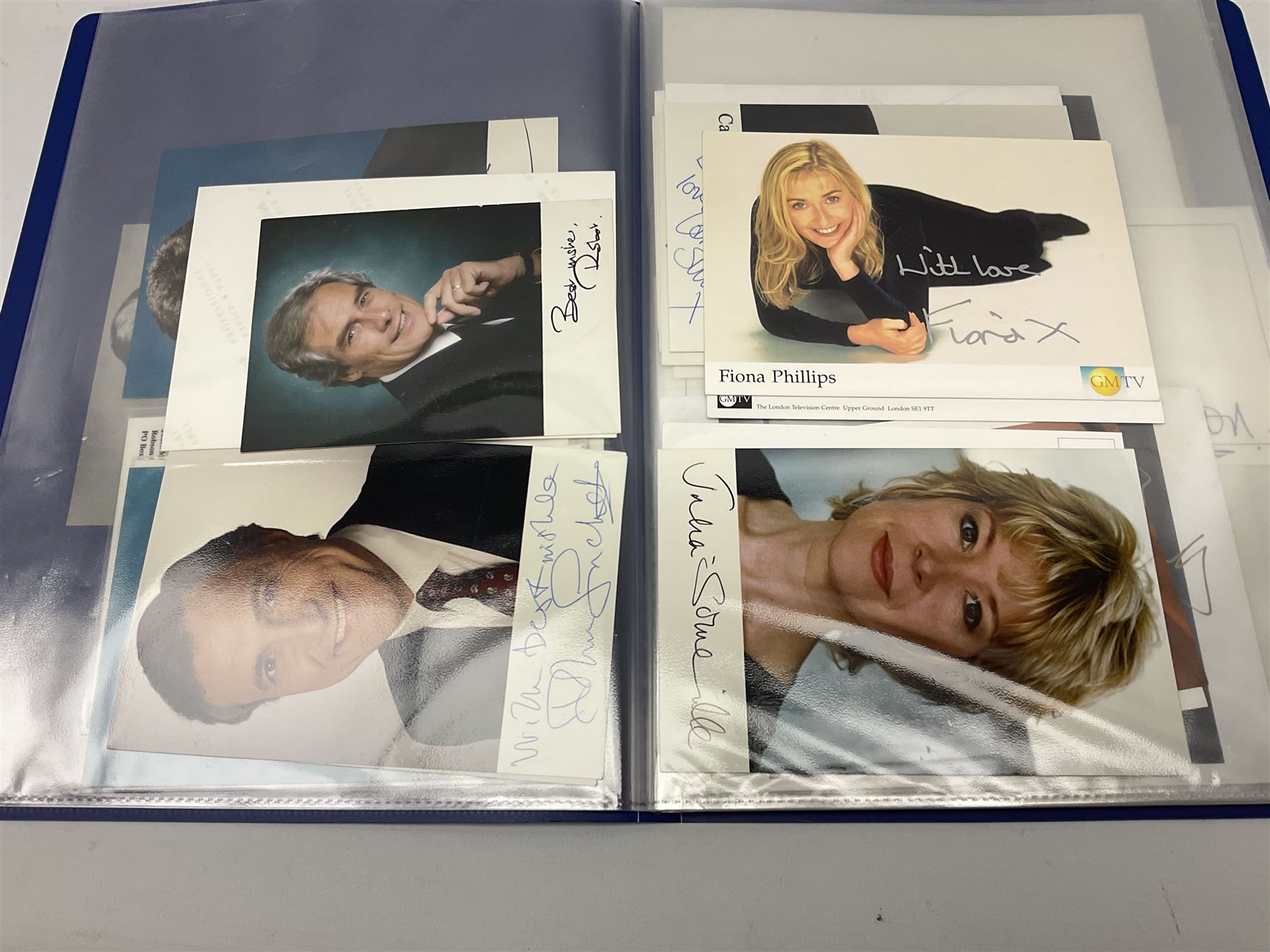 Two folders of over fifty photographs, cards, compliment slips etc of actors, actresses, celebrities, politicians, sports personalities etc, all bearing signatures, including David Frost, Lloyd Grosman, John Suchet, Julia Somerville and othe GMTV presenters, Carol Vorderman, Jackie Collins, Rolf Harris, Timothy Dalton, Pete Postlethwaite, Magnus magnusson, John Major, Kate Moss, Uri Geller, David Beckham, Peter Alliss, Sharon Davies, Kevin Keegan etc
