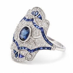Platinum sapphire and diamond dress ring, milgrain set with a single oval cut sapphire, surrounded by single cut diamonds, calibre and vari-cut sapphires, in an pierced design setting, stamped PT 950, total sapphire weight 0.87 carat, total diamond weight 0.45 carat