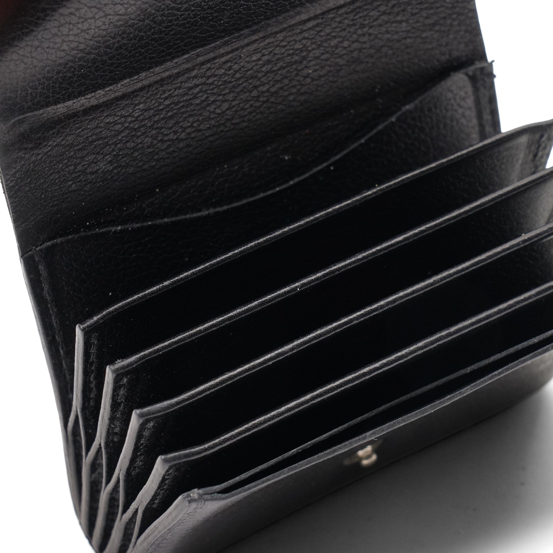 Hermès - black grained leather gusseted card holder, with press-stud fastening and concertina interior, stamped Hermès Paris Made in France, with original box