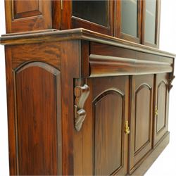 Victorian revival hardwood dresser cabinet, projecting moulded cornice above three glazed doors with shaped tops enclosing shelves, moulded top over three drawers and three panelled cupboard doors, flanked by applied carved brackets, on plinth base
