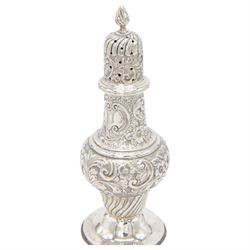 Edwardian silver sugar caster, of typical waisted form profusely embossed with floral and foliate decoration, the removable pierced cover with fluted finial, upon a circular stepped foot, hallmarked William Aitken, Birmingham 1901, H23cm
