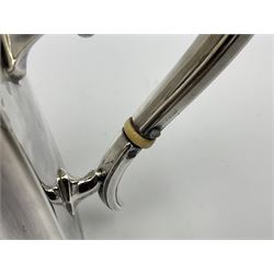 Victorian three-piece silver tea service, comprising teapot, twin handled open sucrier and milk jug, of oval form with shaped rim and C handles, each engraved with crests and bands of strapwork decoration, the milk jug and sucrier with gilt interiors, hallmarked Josiah Williams & Co, Exeter 1881, the teapot with ivory insulators and finial, all contained with a tooled leather, blue silk and velvet lined fitted case, retailed by West & Sun, Dublin 
This item has been registered for sale under Section 10 of the APHA Ivory Act