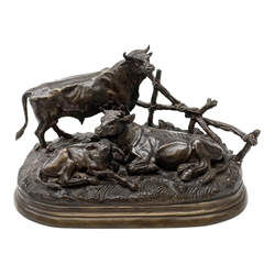 After Jules Moigniez (French 1835-1894), bronze figure group modelled as a bull, cow and calf on naturalistically modelled ground before a fence, upon an oval base, signed J Moigniez, L39cm
