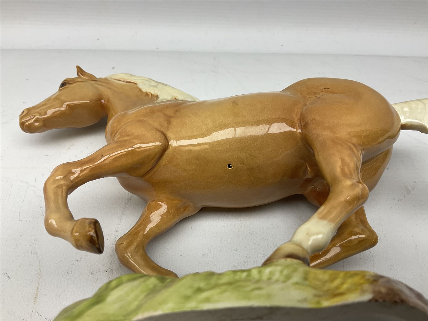 Beswick figure of cantering Palomino horse on base model no 1374, with impressed and printed mark beneath, H18cm