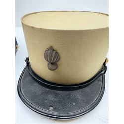 Three French Foreign Legion Kepis; two infantry examples and the third Calvary, each with black peak, original leather sweatband and markers mark stamped inside 