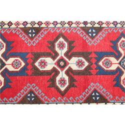 Two Persian rugs, Persian Hamadan hand-knotted rug, ivory ground centred by a terracotta medallion, surrounded by scrolling floral and foliate motifs, dark navy floral border with narrow guard stripes, fringed ends, H 176cm, W 75cm, Persian tribal hand-knotted rug, madder red ground decorated with three large geometric medallions, surrounded by angular motifs, enclosed by multiple geometric borders in dark navy, ivory and red, fringed ends, H 150cm, W 91cm