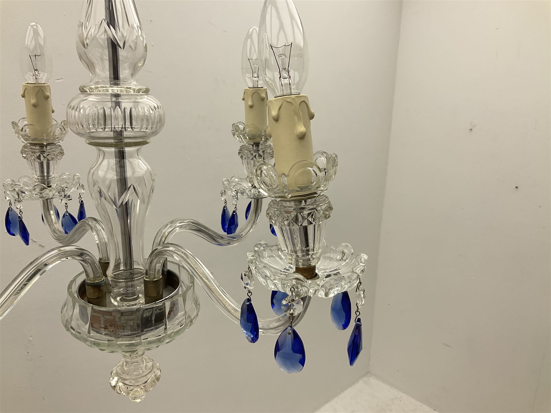 Glass four light chandelier, the baluster shaped central glass column supporting four curved branches with drip pans and blue glass drops, approx height excl fitting H50cm