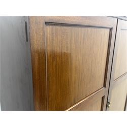Wylie & Lochhead, Glasgow - early 20th century mahogany and satinwood double wardrobe, projecting cornice over panelled doors, interior fitted with mirrored door, shelves, drawers, hooks and hanging rail, raised on bracket supports with ceramic castors
