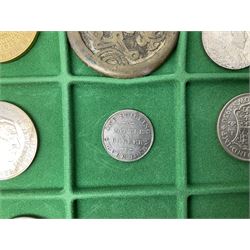 Coins and medallions including, York 1811 one shilling cattle and barber silver token, United States of America 1883O silver Morgan dollar, birds of destiny medal by Malcolm Appleby, Great British King George V 1930 halfcrown, King Edward VII 1902 silver medal, King George V 1916 halfcrown etc, housed in a case with lift out green coin trays