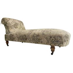 Victorian walnut and hardwood framed chaise longue, drop-back on staggered mechanism, upholstered in floral design fabric, turned feet on castors 