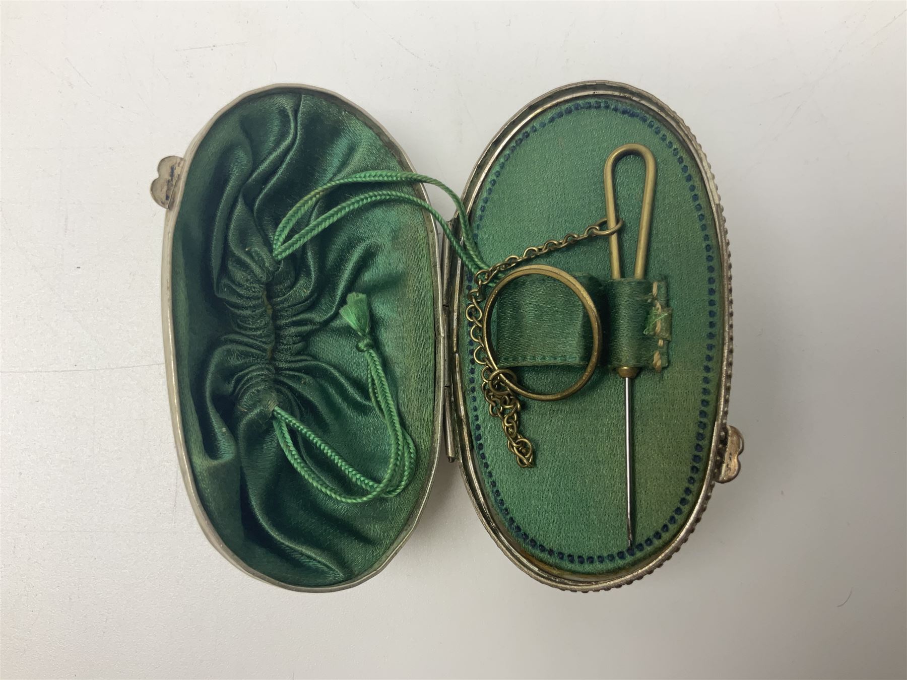 19th century lacquer thimble case with painted portrait of a woman to the hinged lid, together with two mother of pearl egg shaped thimble cases and one other
