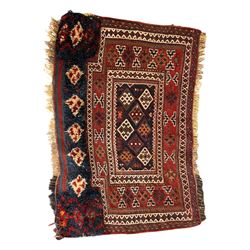 Persian-style wool rug, cream field with floral and geometric motifs, wide floral border (74cm x 142cm); Persian wool rug, beige field with dense floral patterns, narrow floral border (70cm x 144cm); Tribal wool rug, red and navy with diamond motifs (96cm x 60cm); Persian pictorial wool rug, black field with vase, birds, and floral border (70cm x 73cm)