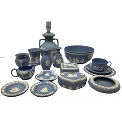 Collection of Wedgwood light blue Jasperware, to include table lamp with twin handles, H27cm, bowl, D20cm, tea cup and saucer, milk jug, two trinket boxes, etc.  