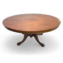 Victorian mahogany breakfast loo table, oval tilt-top on turned pedestal, quatrefoil out-splayed carved supports, scroll carved terminals with brass castors