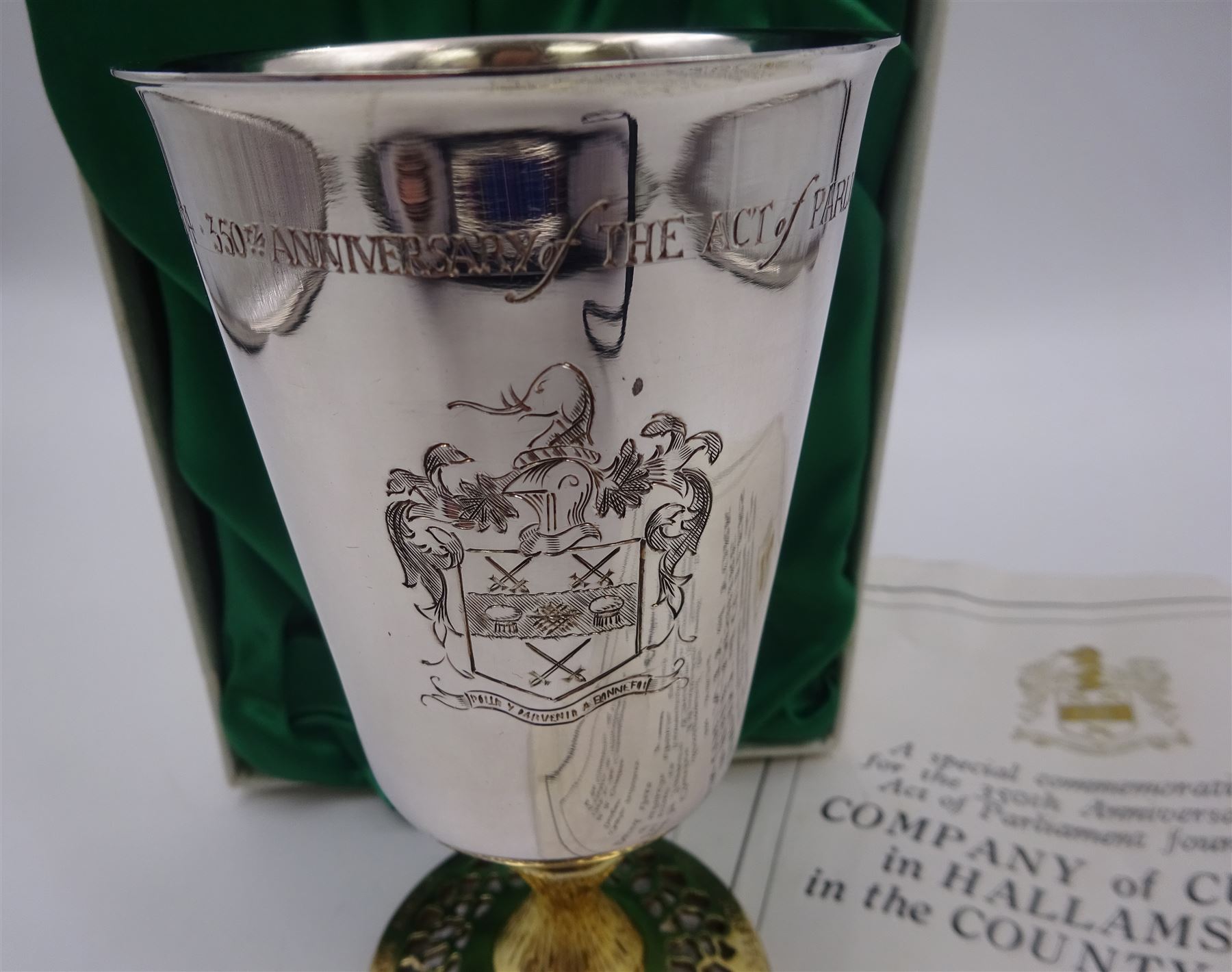 Modern limited edition silver goblet to commemorate the 350th anniversary of the Act of Parliament founding the Company of Cutlers, the tapering cylindrical bowl engraved with crest, with gilt interior and upon parcel gilt textured knopped stem and pierced circular foot, hallmarked James Dixon & Sons, Sheffield 1974, number 21/210 , in original fitted box with paperwork