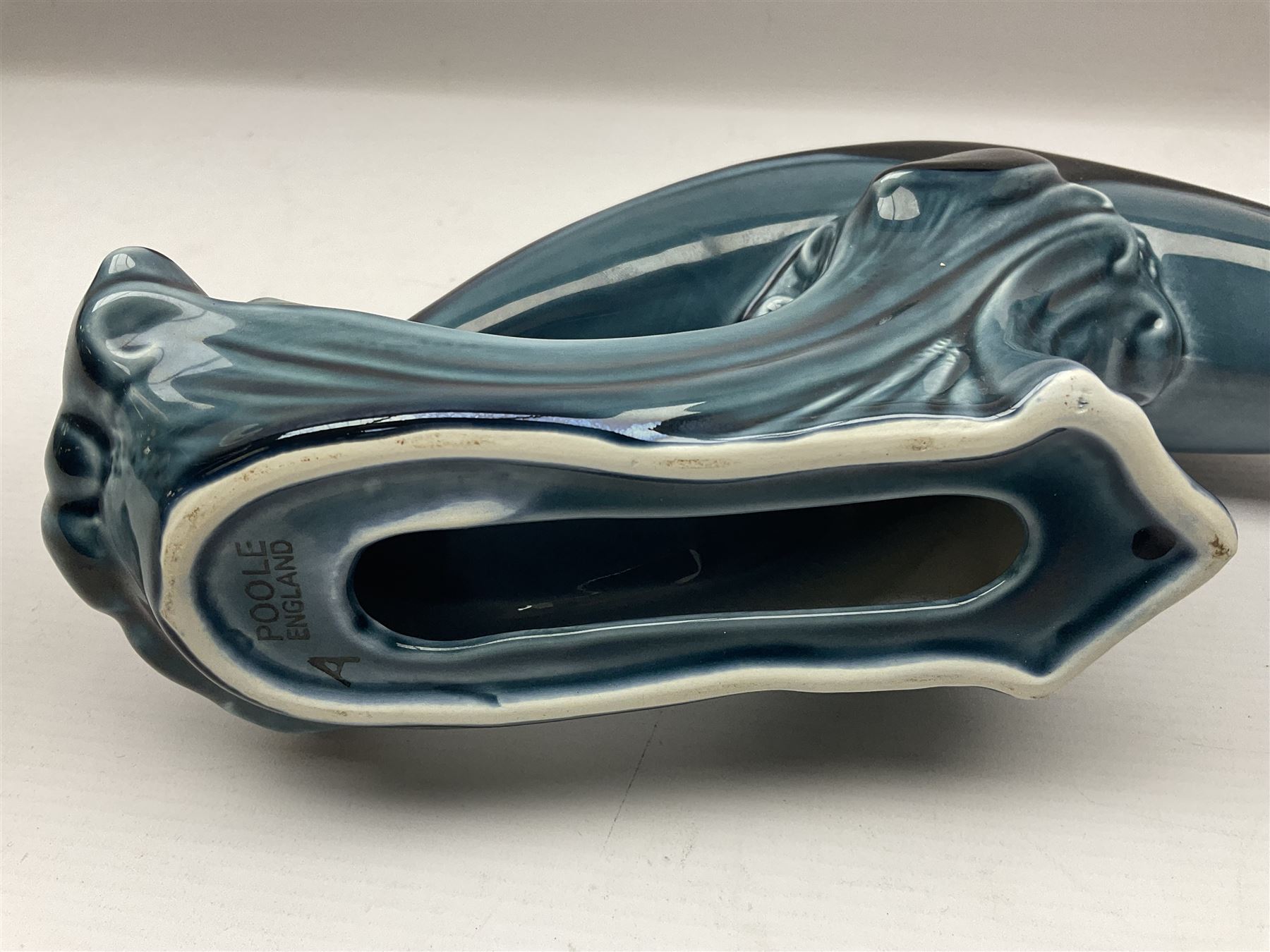 Poole pottery Dolphin, together with Royal Worcester miniature teacup and saucer, Royal Crown Derby miniature teacup and saucer in Derby Posies and one other