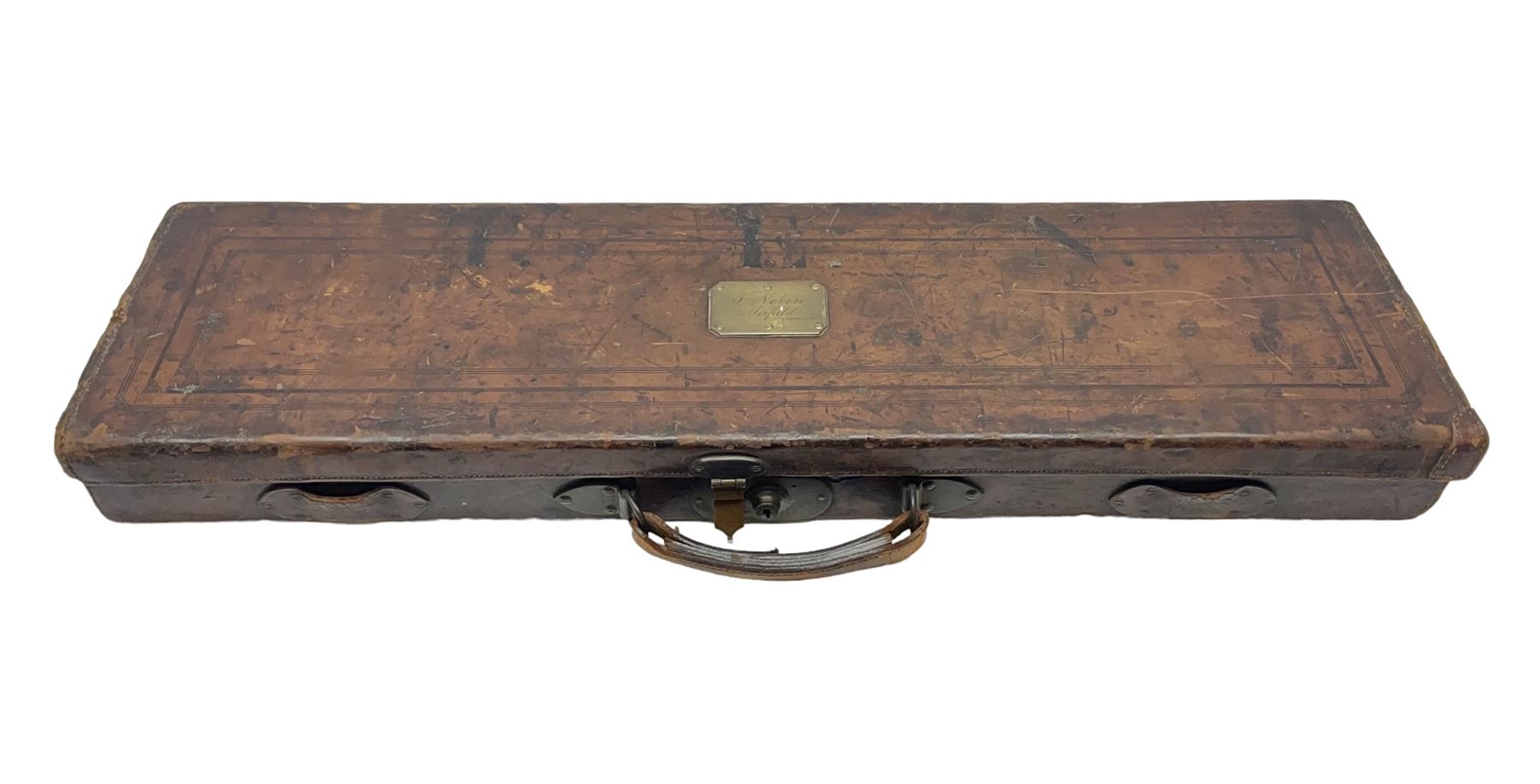 Leather shotgun case, the red baize lined interior with the trade labels of Westley Richards & Co., London, a brass plaque inscribed 'T Nevin, Mirfield, Yorkshire' to cover, with key, case to fit barrel 76cm (30 inches)  
