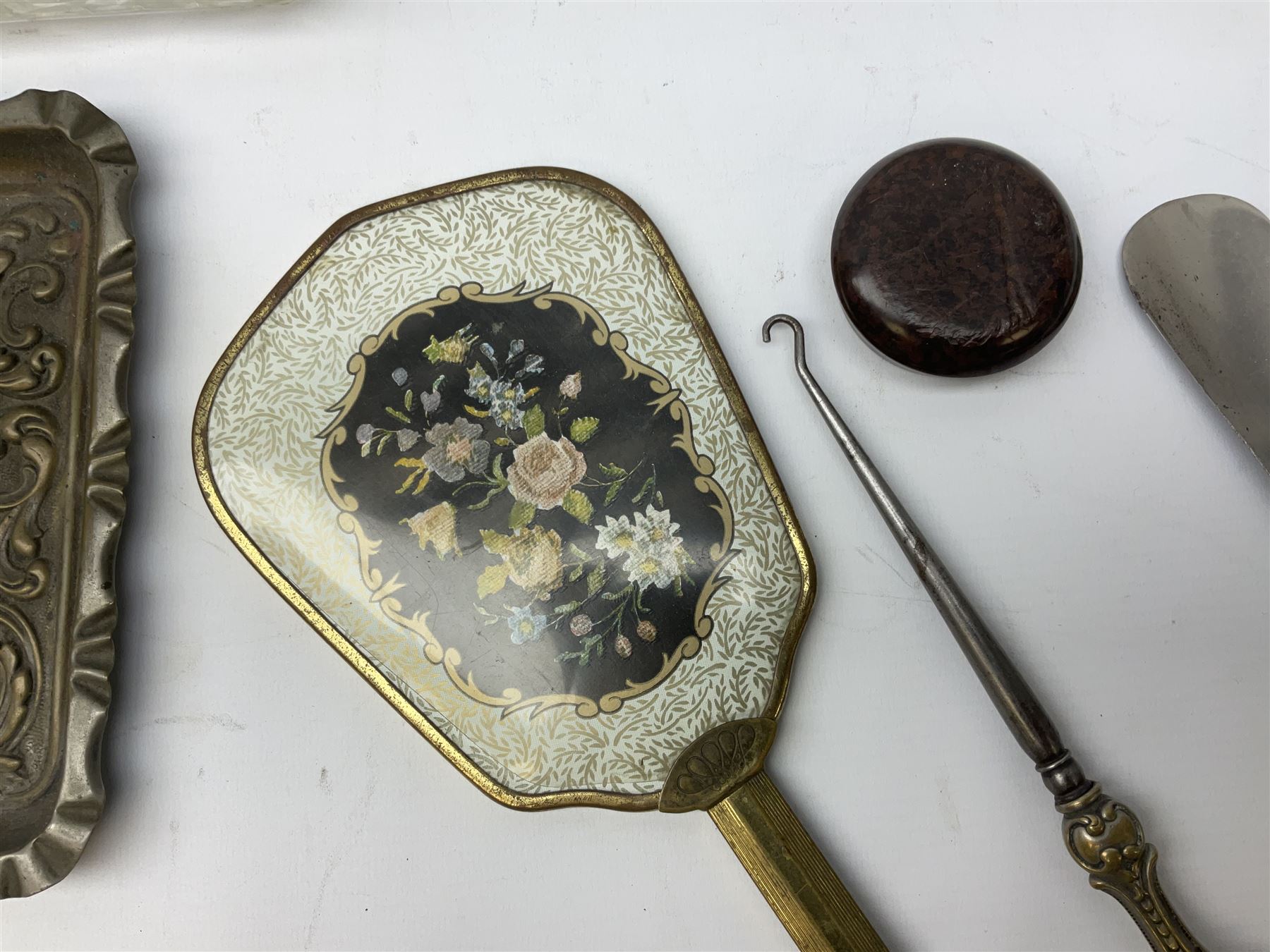 Glass dressing table tray, scent bottles and lidded bowl, metal mounted foliate design hair brushes and handheld mirrors etc