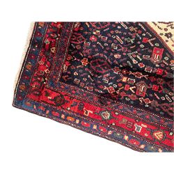 Persian Kurdish rug, blue ground field decorated with various stylised motifs and overlapped lozenge medallion, repeating guarded border