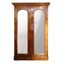 Victorian figured walnut double wardrobe, projecting moulded cornice over twin arched silv...