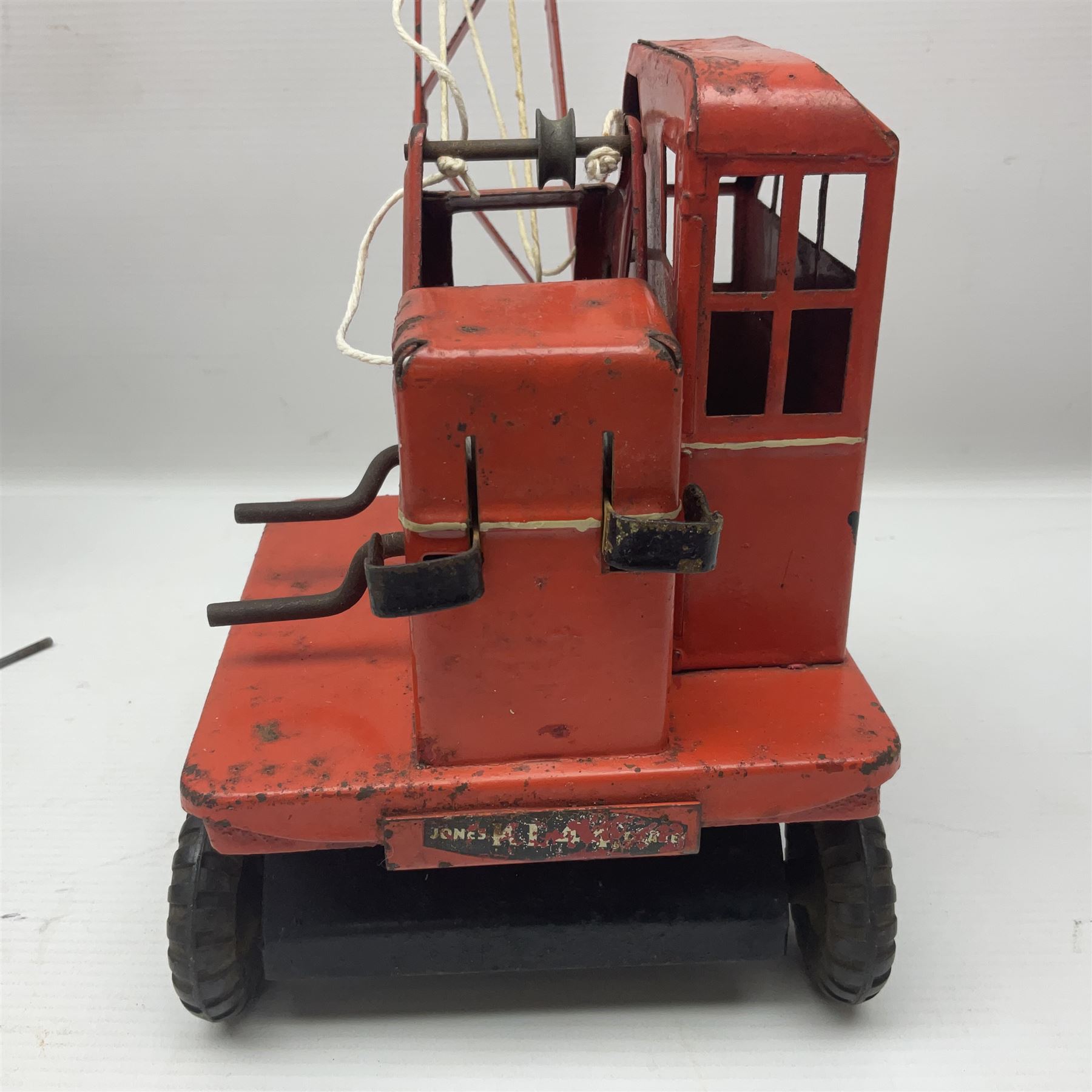 Mamod TE1a steam traction engine with burner, bunker, steering rod and funnel; red and black painted Tri-ang tin-plate Jones KL44 mobile crane; and two Hull Savings Bank Home Safe money boxes; all unboxed (4)