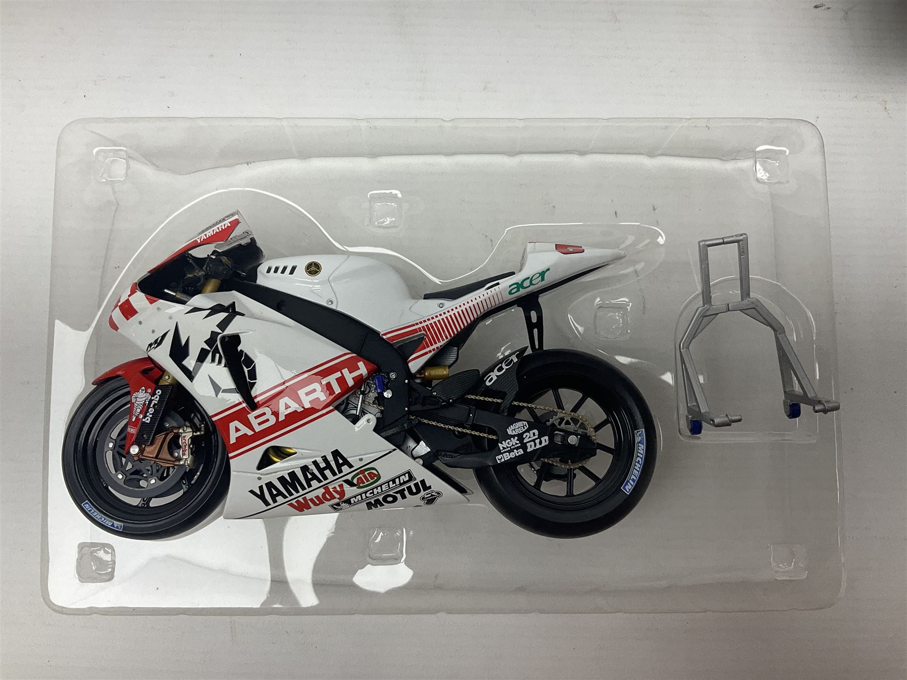 Three Ixo Models 1:12 scale die-cast models of motorcycles - BRB007 Honda NSR500 Michael Doohan 1998; BRB001 Honda RC211V Valentino Rossi 2003; and Yamaha YZR-M1 Colin Edwards MotoGP Phillip Island 2007; all boxed (3)