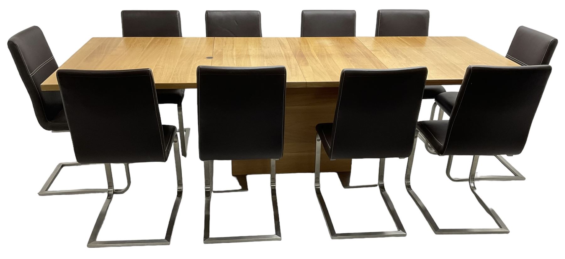 Contemporary walnut extending dining table, rectangular pull-out extending action top with two additional leaves, on rectangular base with burnished metal feet (160cm - 258cm x 100cm, H78cm); together with a set of ten cantilever dining chairs upholstered in stitched brown leather, on burnished metal supports 