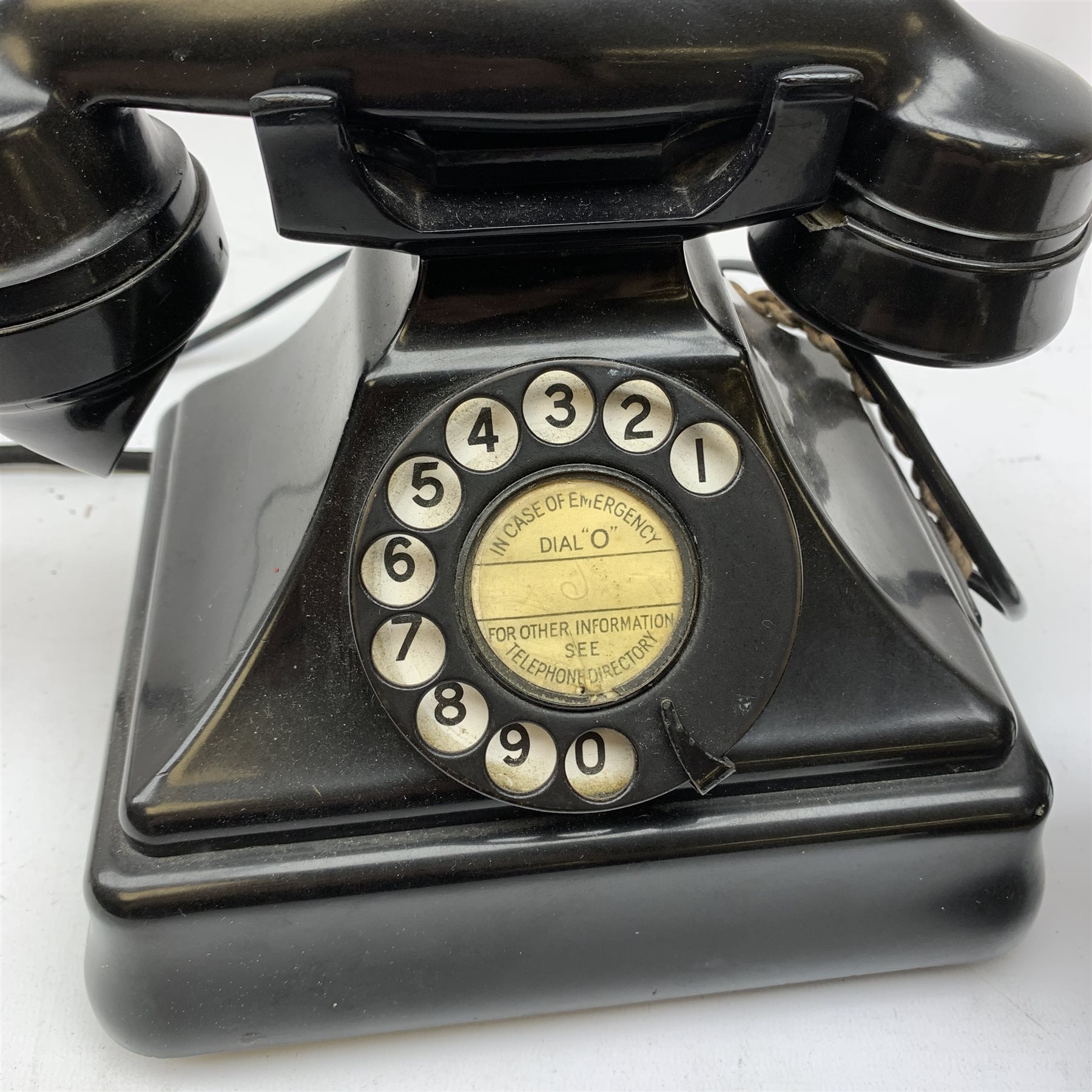  A Vintage black Bakelite telephone, together with another vintage metal bodied example with Bakelite receiver, marked Bell.   