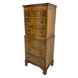 Burton Reproductions walnut chest on chest, fitted with six serpentine drawers
