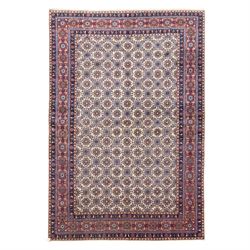 North West Persian Tabriz hand-knotted carpet, ivory field densely decorated with an all-o...