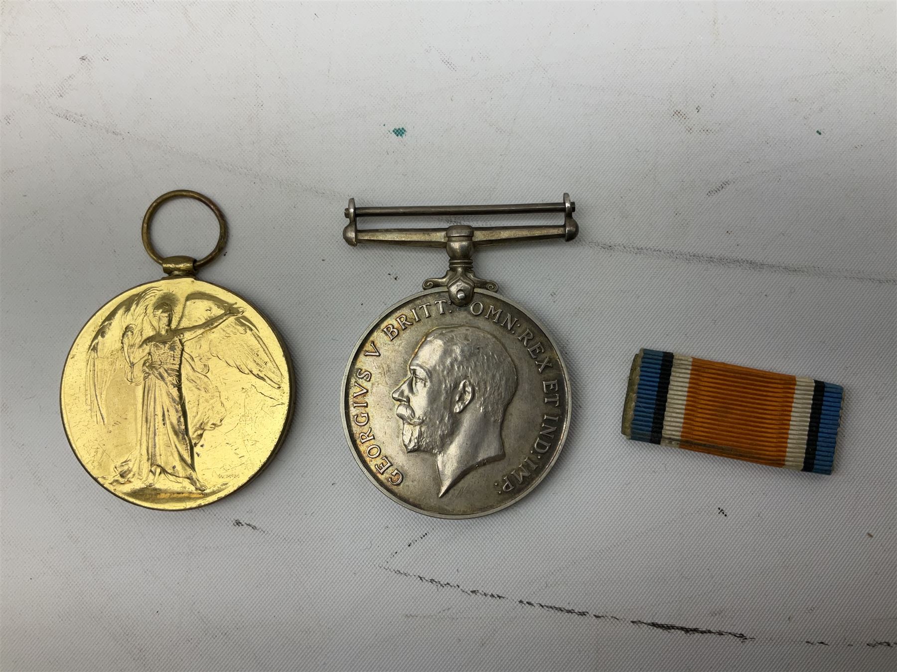 Mostly Great British coins including Queen Victoria 1887 and 1888 crowns, pre-decimal coinage, various five pound coins etc and a WWI War and Victory medal pair named to '16903 PTE. H. SCHOFIELD. 2-CO. OF LOND. Y.'