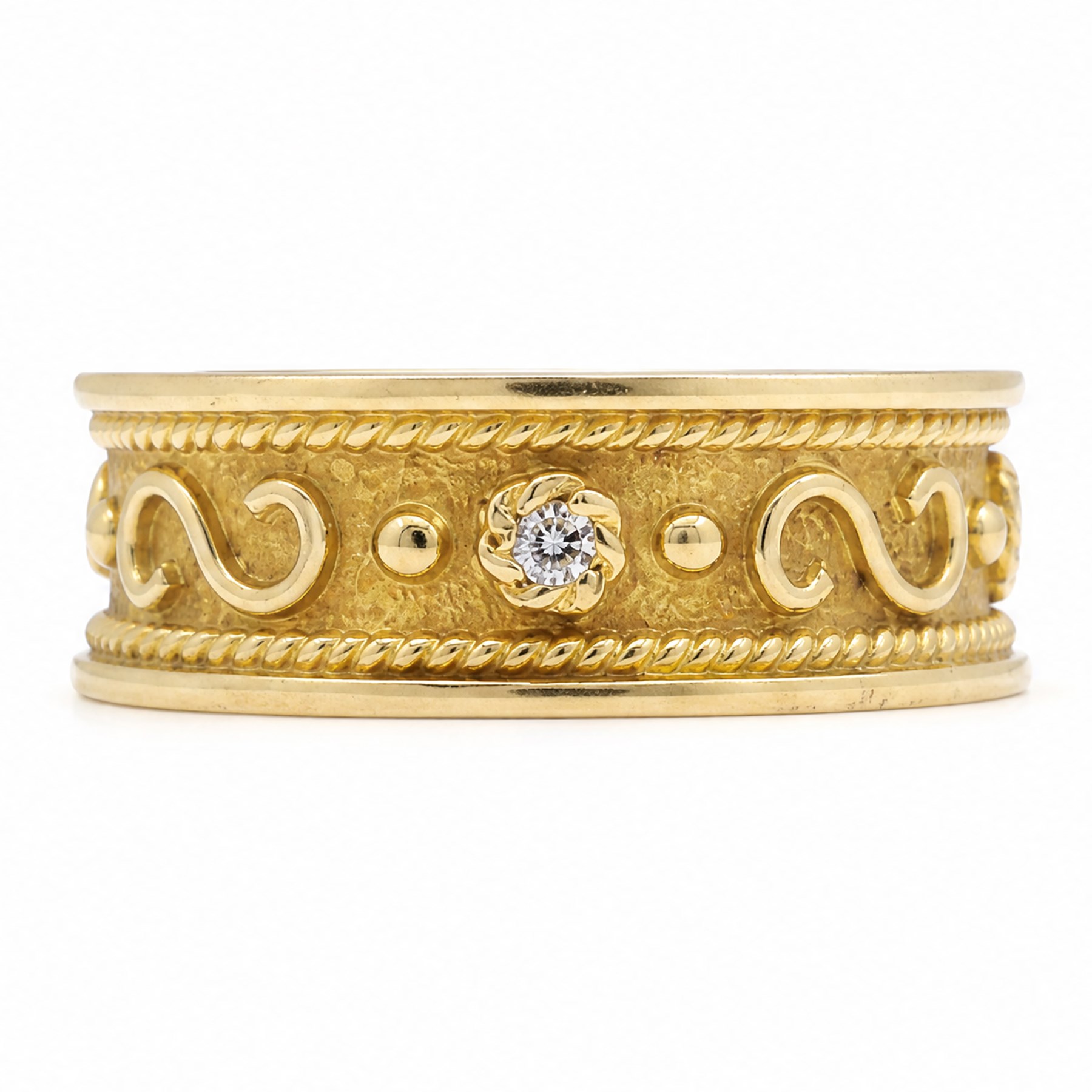 18ct gold diamond band, four round brilliant cut diamonds spaced by scroll and bead  motifs, within a rope twist border 