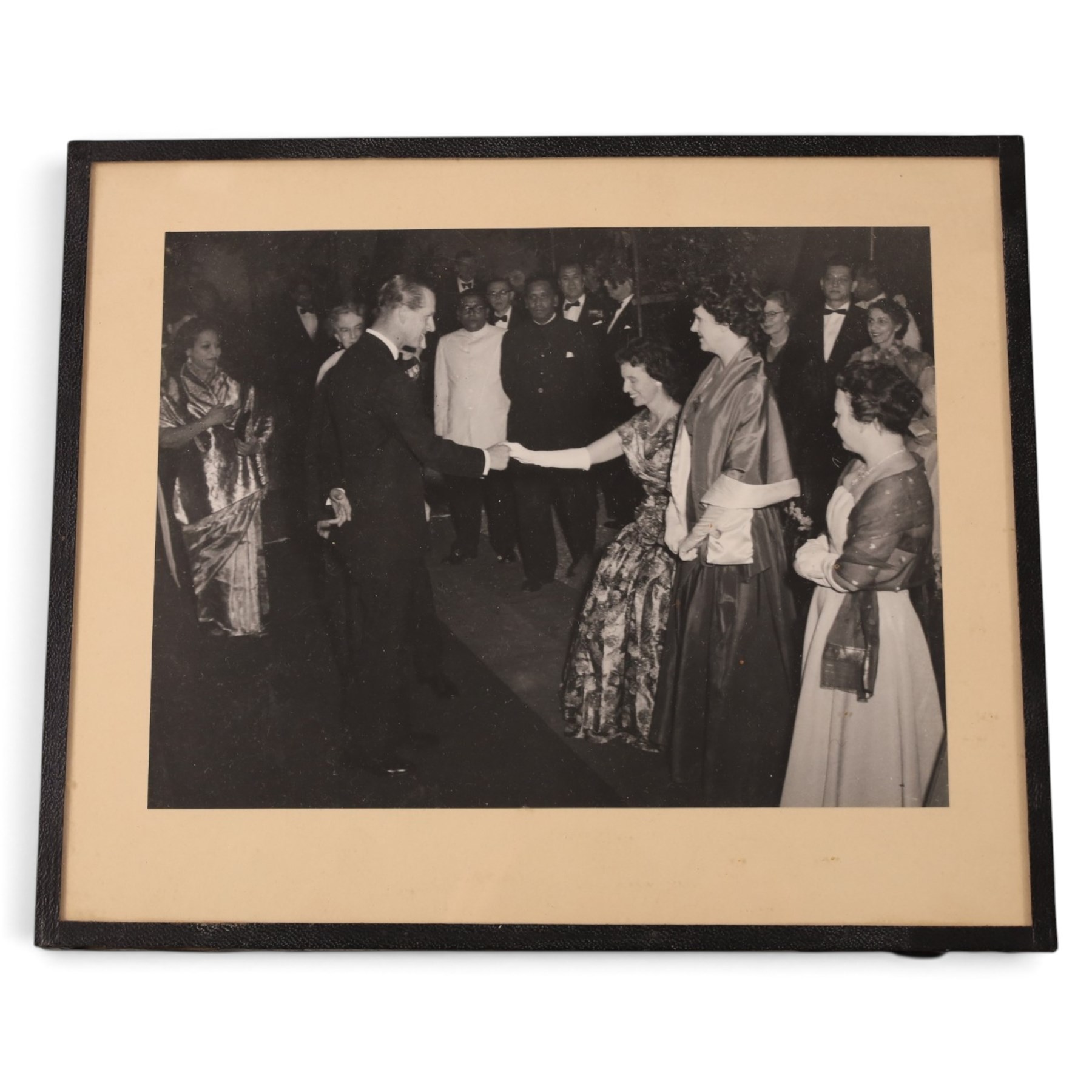HRH The Duke of Edinburgh signed black and white presentation portrait photograph of Prince Philip wearing Naval uniform, signed in ink on mount ‘Philip 1959’, 20cm x 15cm, contained within a rectangular silver frame, together with a framed photograph of the Prince in India 1959 greeting guests at a formal event and a further black and white photograph