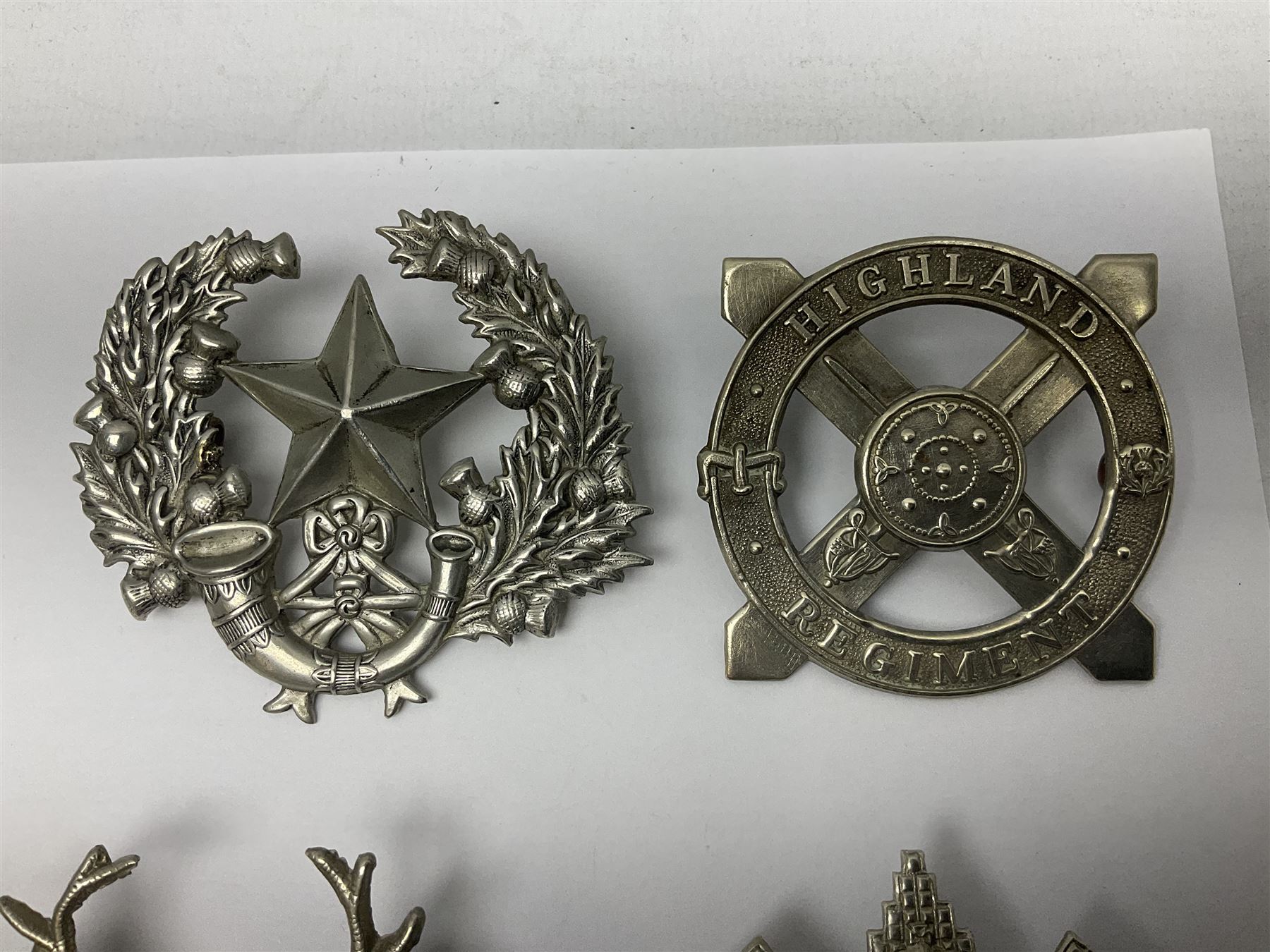 Thirteen Scottish metal Glengarry badges including Black Watch, Highland Regiment, Cameronians, Argyll & Sutherland, Seaforth Highlanders, Kings Scottish Own Borderers etc