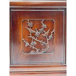 Chinese hardwood sideboard, three drawers above four cupboards, the doors relief carved with flowers and birds 