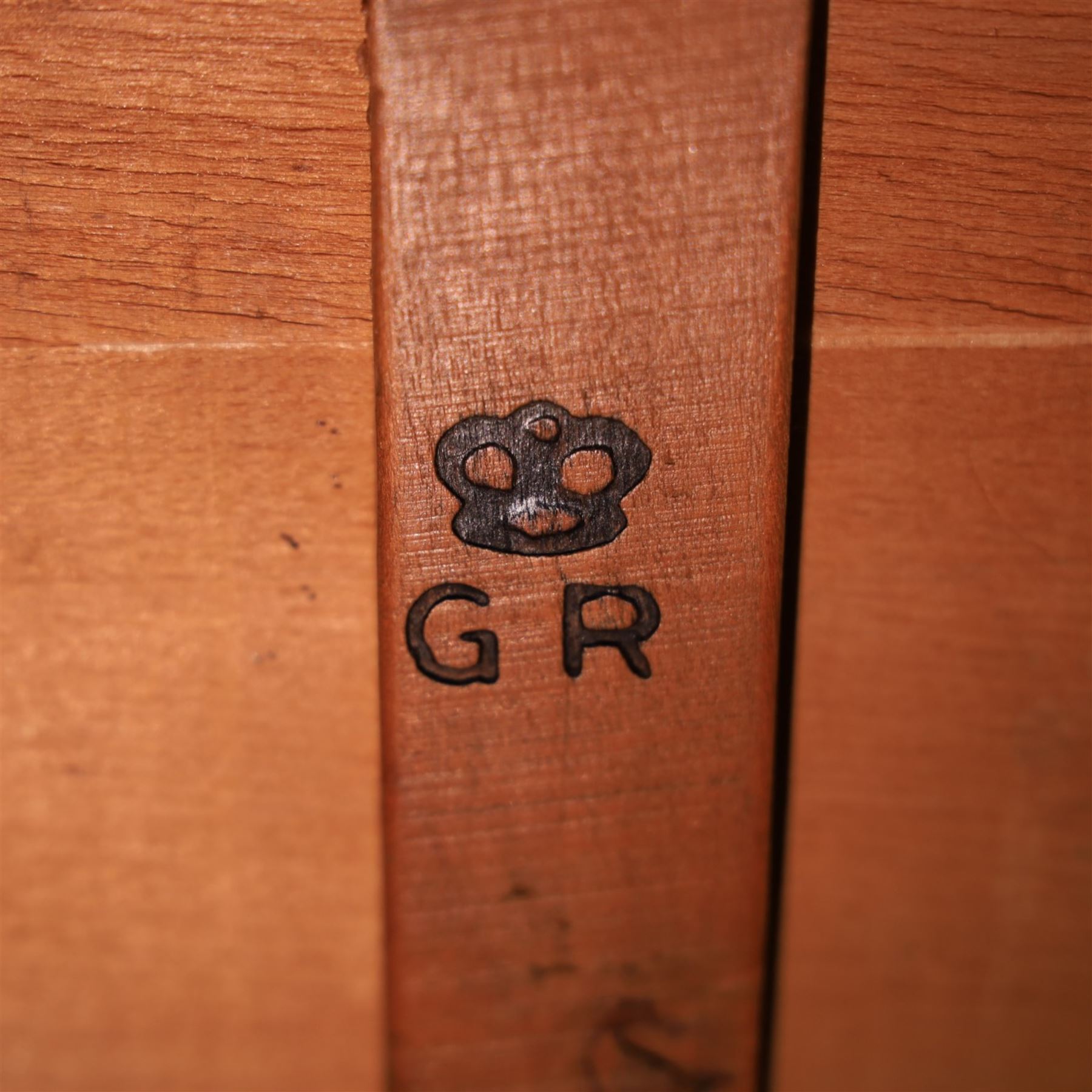 Mid 20th century Gordon Russell attributed oak pedestal desk, rectangular top with black leather inset writing surface and gallery back, fitted with five drawers with tubular metal handles, the kneehole united by a metal stretcher, raised on square supports, bearing GR crown stamp