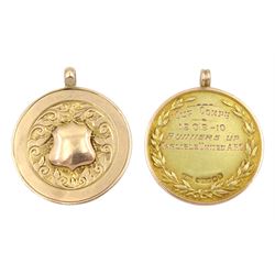 Edwardian gold 'Cumberland Football Association' fob by Vaughton & Sons, Birmingham 1909 and one other gold fob with blank cartouche, both hallmarked 9ct