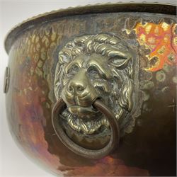 Copper pedestal punch bowl, with planished decoration with twin lion mask and ring handles and applied coins, H18cm
