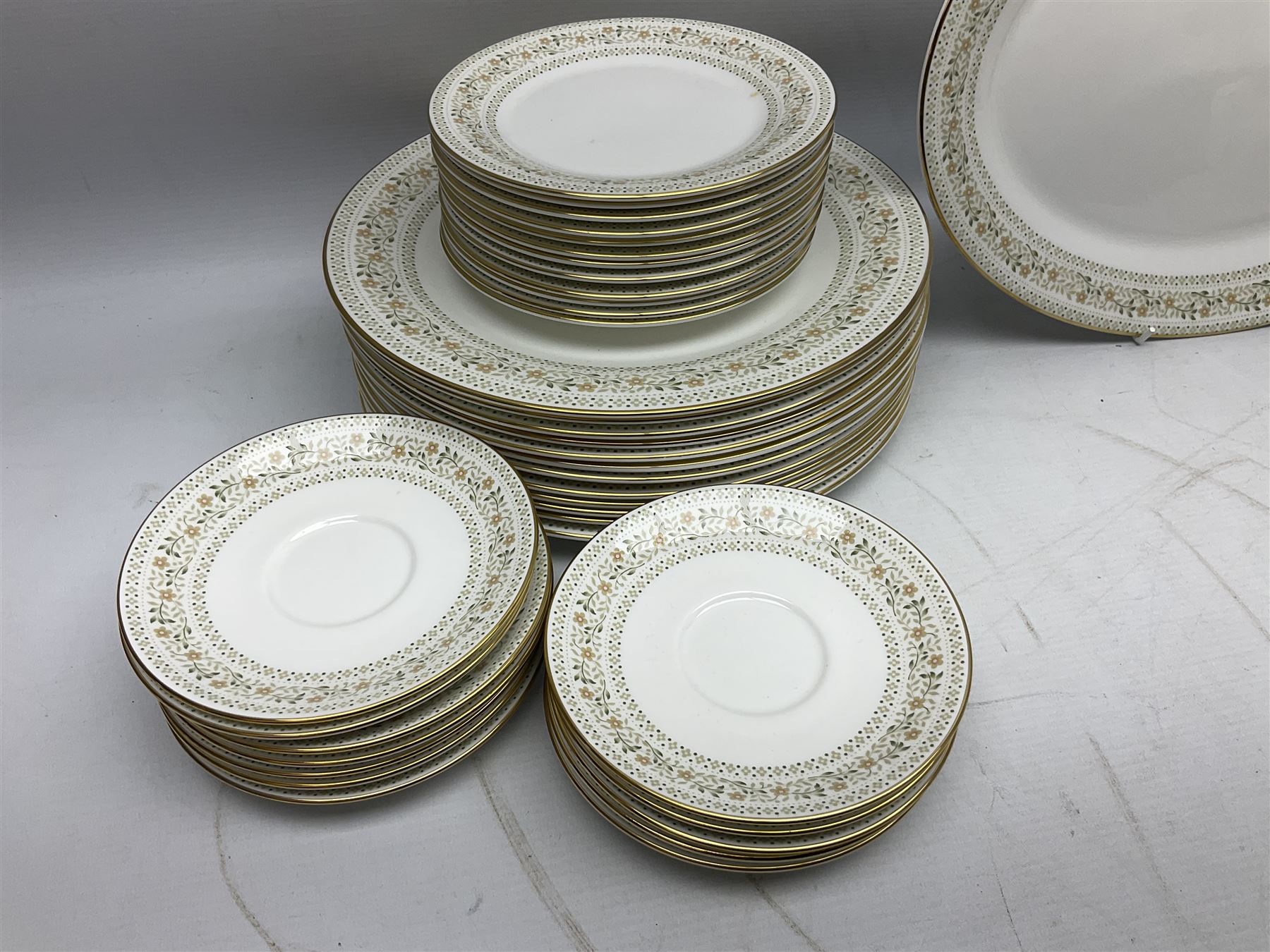 Royal Doulton Paisley pattern tea and dinner service for twelve, comprising dinner plates, side plates, soup bowls, dessert bowls, tea plates, two lidded tureens, sauce boat and saucer, sucrier and jug, oval serving dish and teacups and saucers