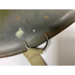 American first type paratrooper helmet with post-WW2 strap and D-rings and later 1944 liner bearing Firestone Tyre and Rubber Company mark; green textured finish