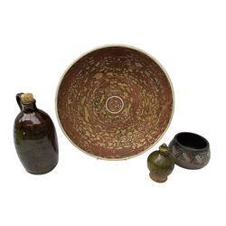 Group of studio pottery to include shallow bowl of ochre and terracotta colour pallete with flaked design, engraved ‘Goy’ to reverse, W33cm, green money box of ovoid form and two others (4)
