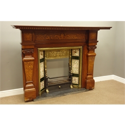  Large Edwardian mahogany fireplace, projecting dentil cornice, panelled frieze inlaid with birds, floral urns and scrolling interlaced foliage, moulded aperture, tapered and sloped pilastered with inlays, scrolled and ball carved capitals, stepped moulded plinth, inset with brass moulded and bead surround, tiled uprights, frieze decorated with urn and flowers, geometric border, cast iron fire front, rectangular slate hearth, W183cm, H135cm (max)  