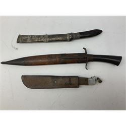 Burmese dha dagger with 15cm steel blade, white metal ferrule and horn handle, in white metal and filigree scabbard L30.5cm; a Burmese long bladed knife with horn handle and brass mounted teak scabbard; and another Eastern dagger in sheath (3)
