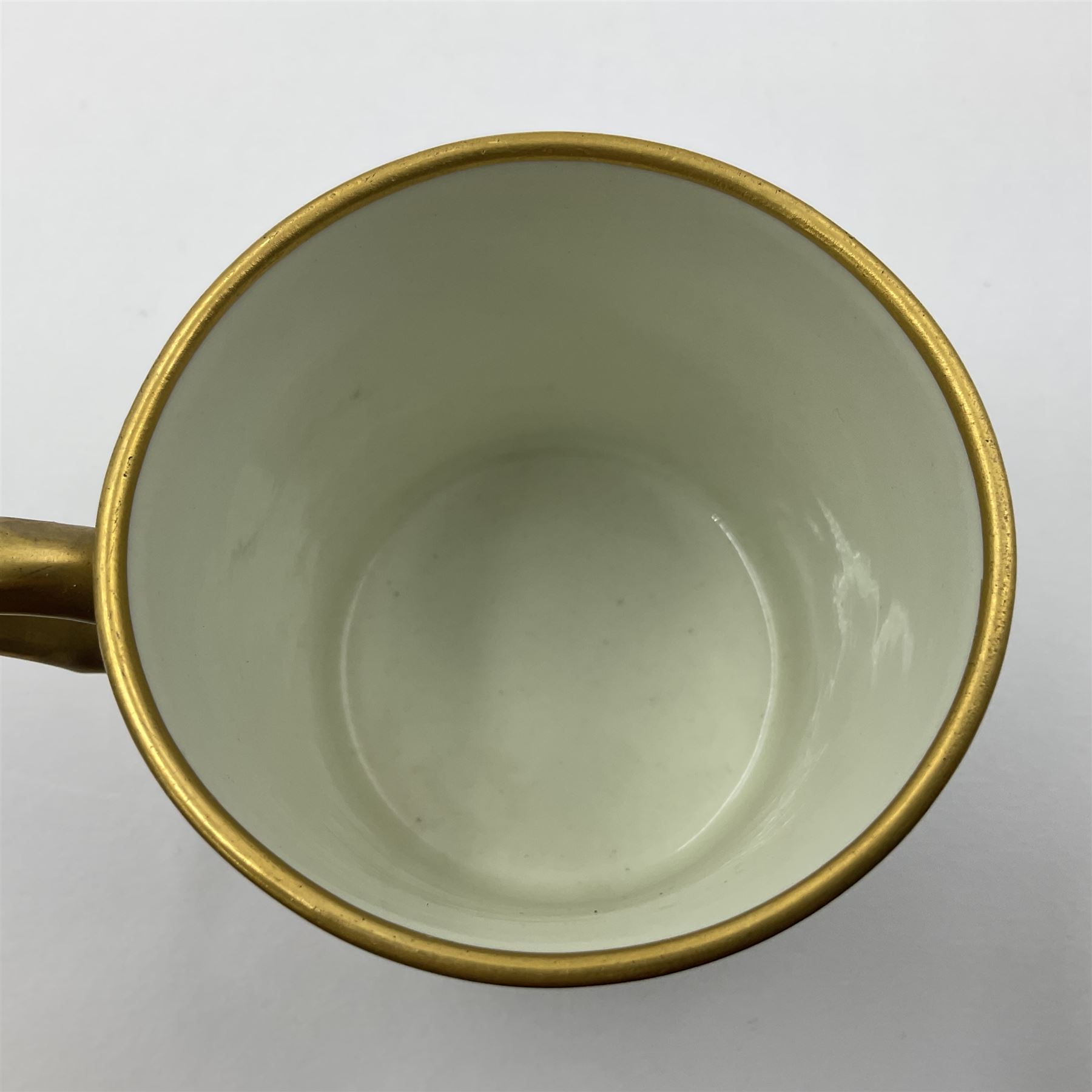 Sèvres soft paste porcelain coffee can and saucer with date code for 1767, painted with floral and laurel leaf garlands within blue scalloped and gilt borders, interlaced LL monogram enclosing the date letter O above painters mark for Catrice, coffee can H7.5cm, saucer D15cm