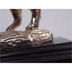 Filled silver model of a rhinoceros by Afrisilver, upon lacquered wooden base, H11.5cm