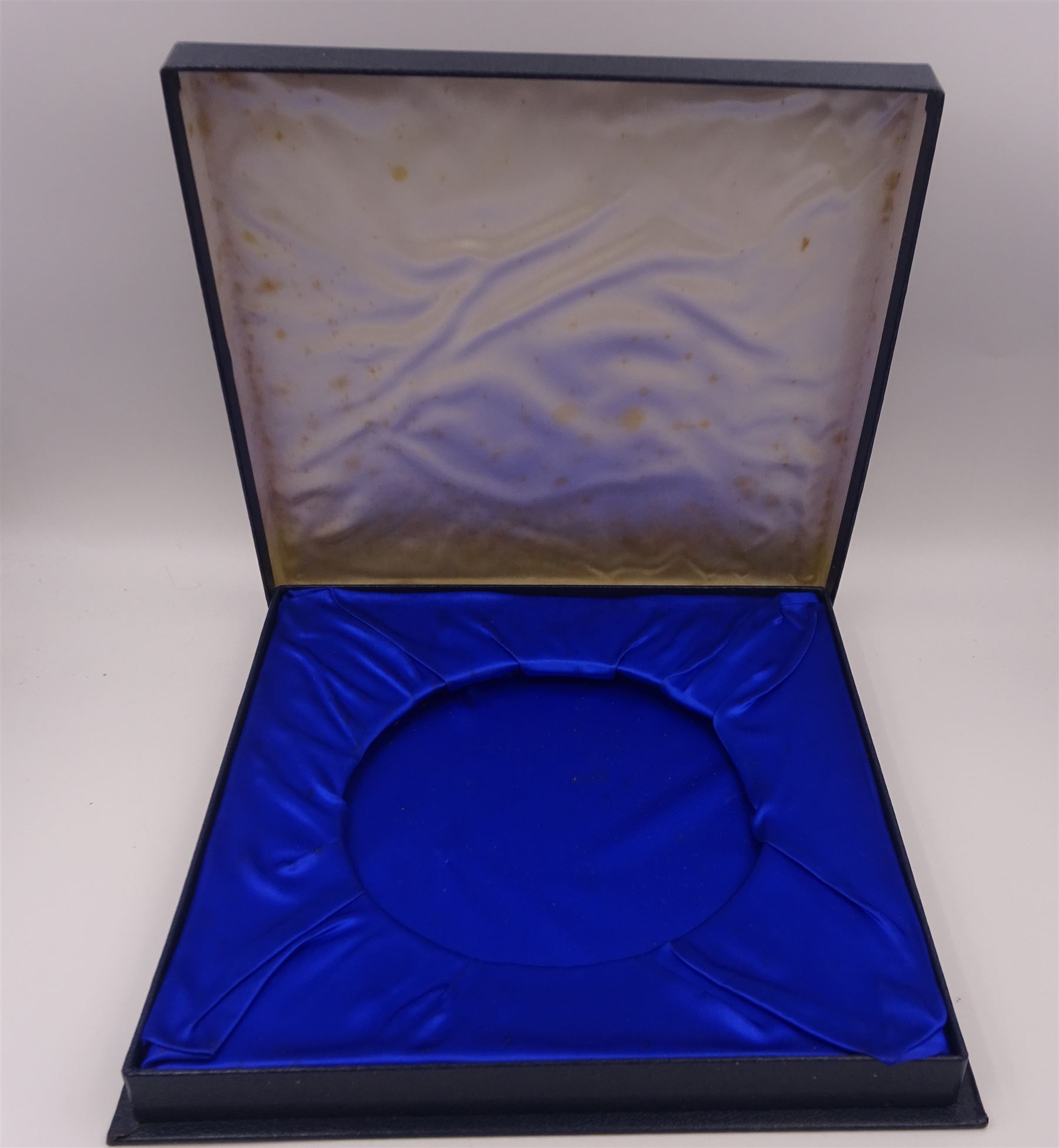 Modern limited edition silver salver, celebrating the achievements of Grundy, champion racehorse of 1975, each of circular form with gadrooned rim and plaque to centre depicting jockey mounted upon Grundy, designed by Stuart Devlin, limited edition no. 15/500, hallmarked London 1976, makers mark LH, D23cm, within silver lined fitted box and limited edition certificate 