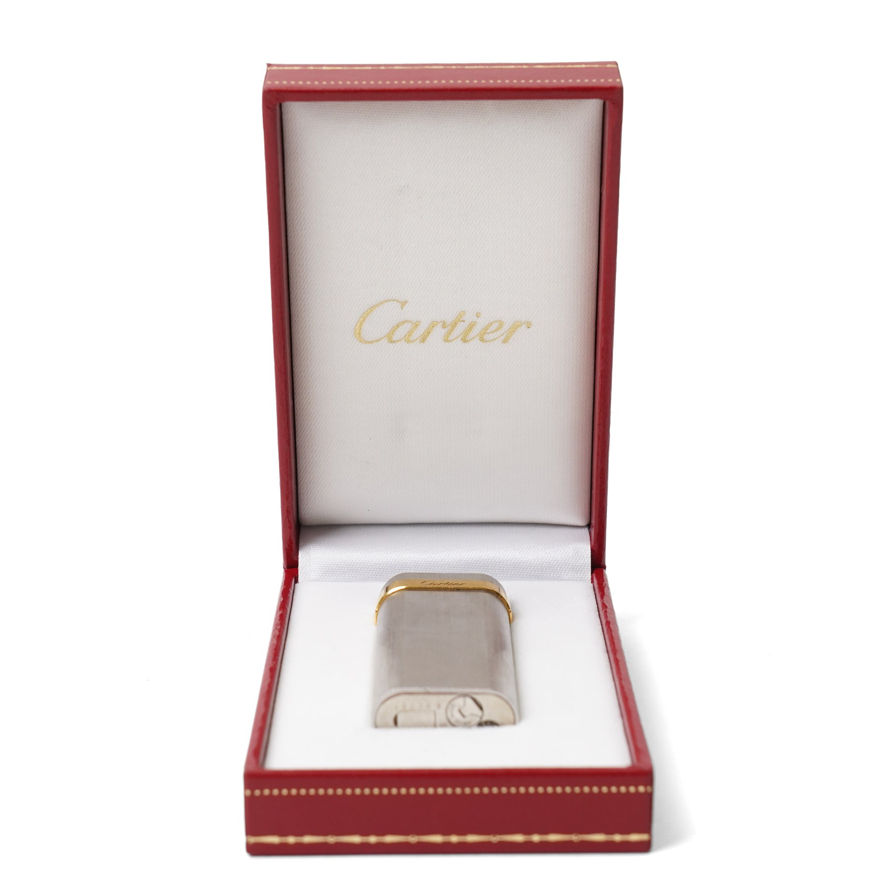 Cartier - silver-tone and gold-tone pocket lighter, with brushed vertical finish, hinged cover and gold-tone band signed Cartier, base signed Cartier and numbered, with original fitted presentation box, outer box and international guarantee booklet