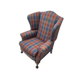 Georgian design wingback armchair, upholstered in tartan fabric, raised on cabriole supports with ball and claw feet
