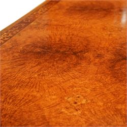 Arthur Brett & Sons - late 20th century twin pedestal dining table in the Second Empire style, the oval Amboyna burl veneered top, bordered with tulipwood crossbanding and delicate floral marquetry inlay, and rosewood crossbanded outer border within gilt gadrooned edge, over two mahogany triform pedestal bases with rosewood crossbanding and decorated with neoclassical marquetry of tied ribbons, leafy sprays, and scrolling acanthus decoration, raised on carved and gilded lion paw terminals on plinth bases, underside with maker's label