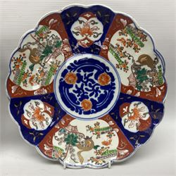 Three Japanese Imari chargers with scalloped edges, largest D38cm